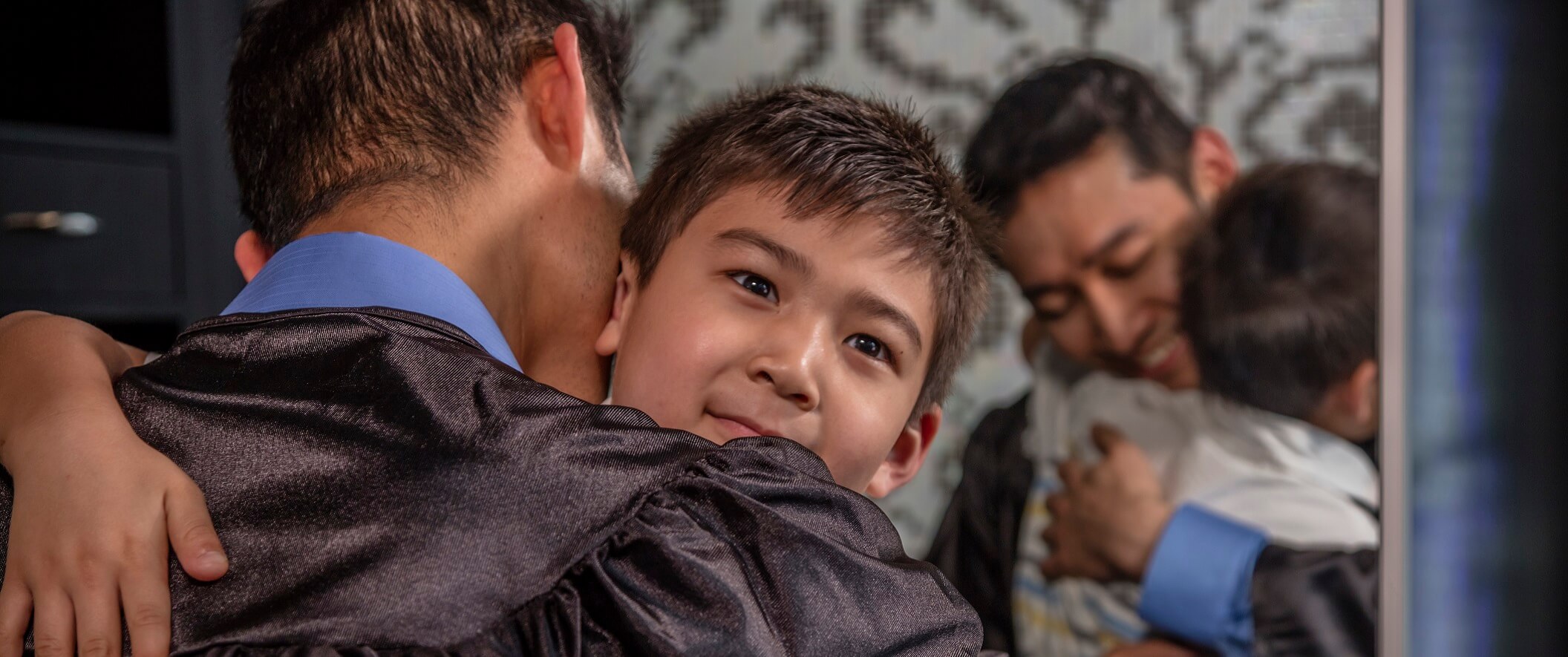 SKCTC Student hugging his child after graduation