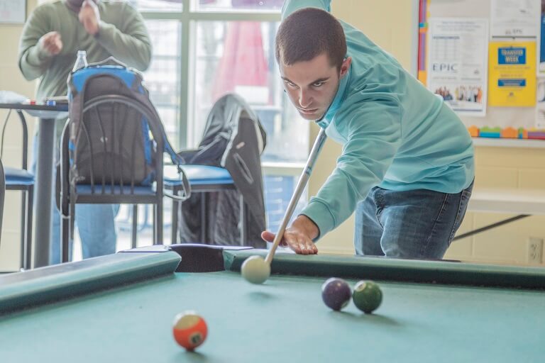 man playing pool